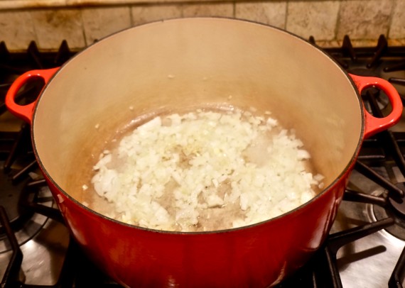 Parsnip soup onions in pot