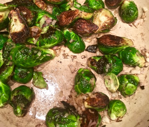 braised brussels sprouts in pan with onion