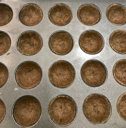 pecan tassies uncooked in pan