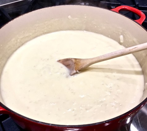 scalloped potatoes sauce in pan