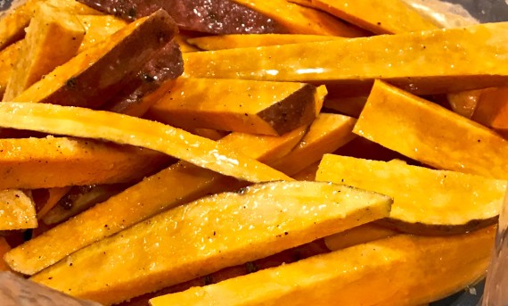 Baked sweet potato fries cut iwth oil and salt