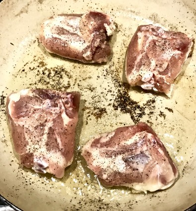 chicken thighs tomato chicken browning in pan