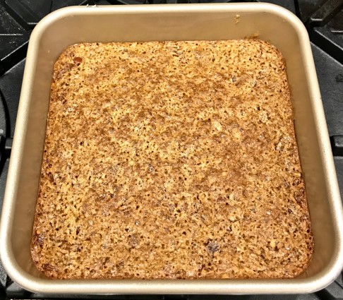 pecan coconut bars finished with topping in pan