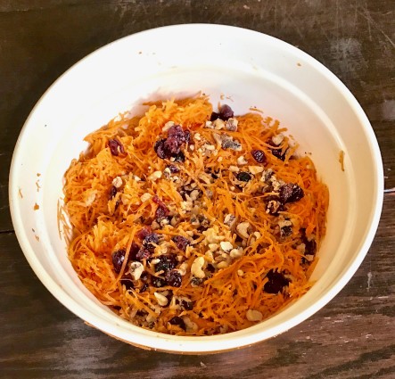 Carrot salad carrots, walnuts and currants in bowl