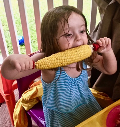 Jenna eating corn