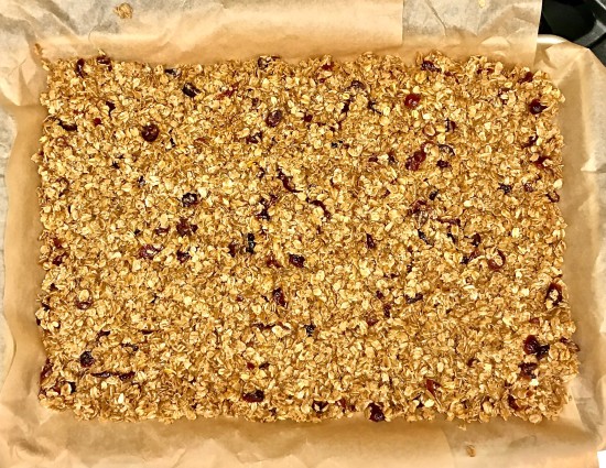 Granola bar transferred to baking sheet